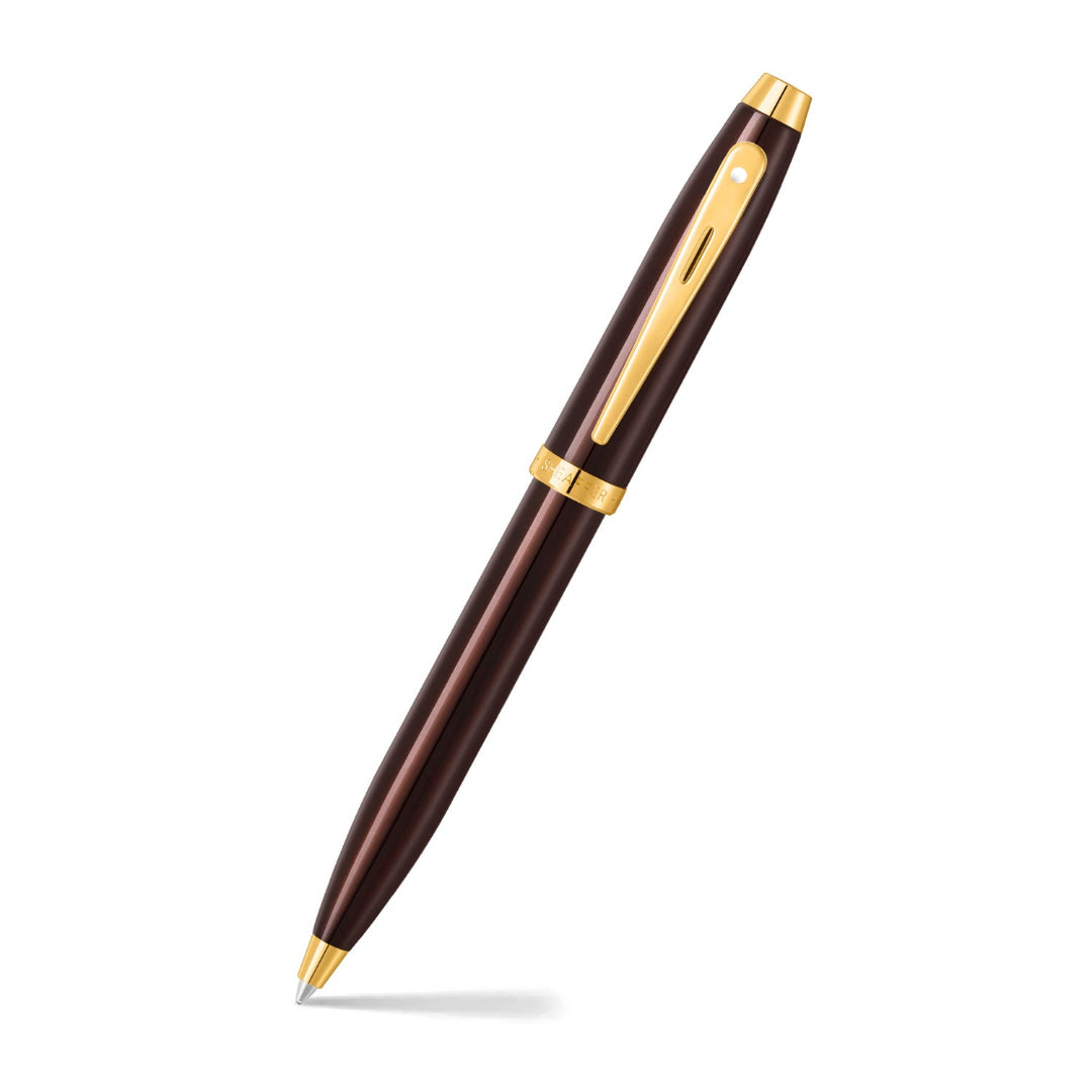 Sheaffer 100 9370 Glossy Coffee Brown Ballpoint Pen With PVD Gold-Tone Trims angled writing shot