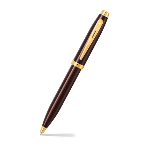 Sheaffer 100 9370 Glossy Coffee Brown Ballpoint Pen With PVD Gold-Tone Trims angled writing shot