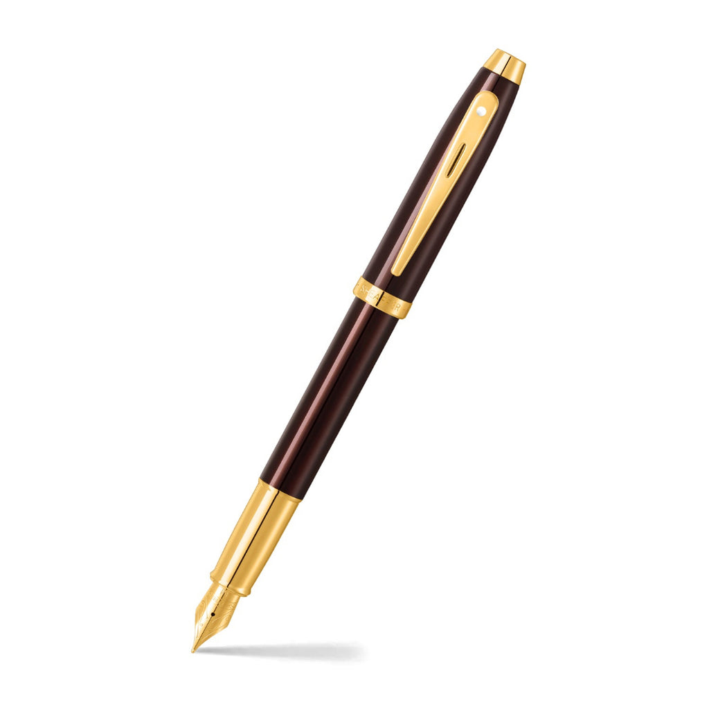 Sheaffer 100 9370 Glossy Coffee Brown Fountain Pen With PVD Gold-Tone Trims angled writing shot