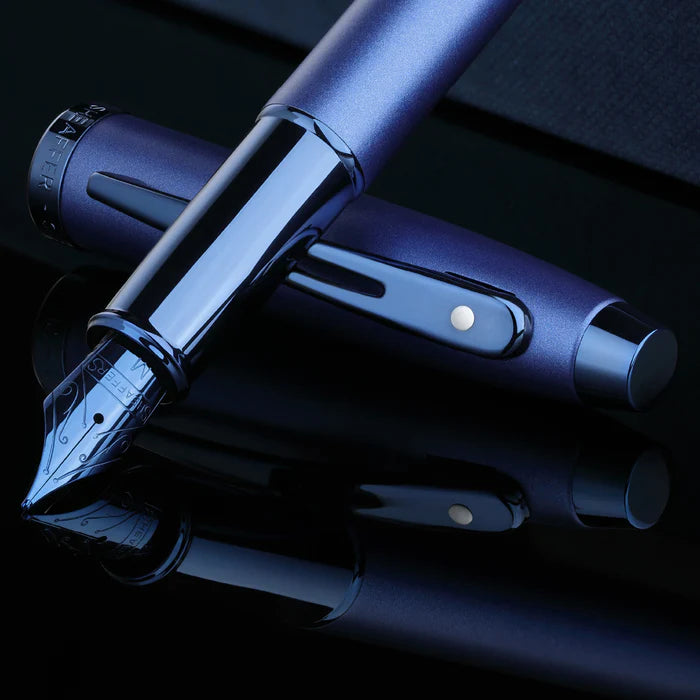 Sheaffer 100 9371 Satin Blue Fountain Pen With PVD Blue Trims on blue satin fabric