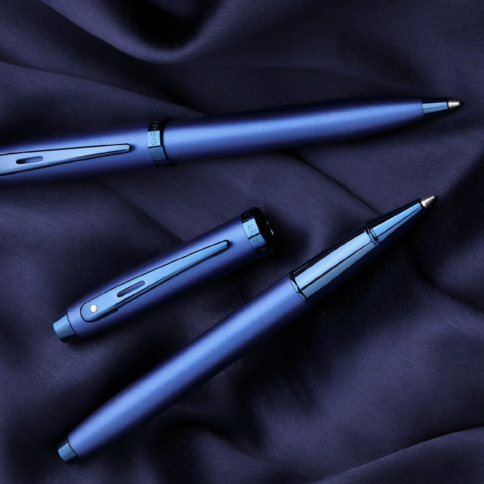 Sheaffer 100 9371 Satin Blue Rollerball Pen With PVD Blue Trims on blue satin fabric