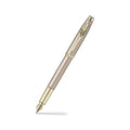 Sheaffer 100 Emily in Paris 9377 Champagne Gold Fountain Pen with Champagne Gold Trims and Bow-Shaped Clip Emblem angled writing shot