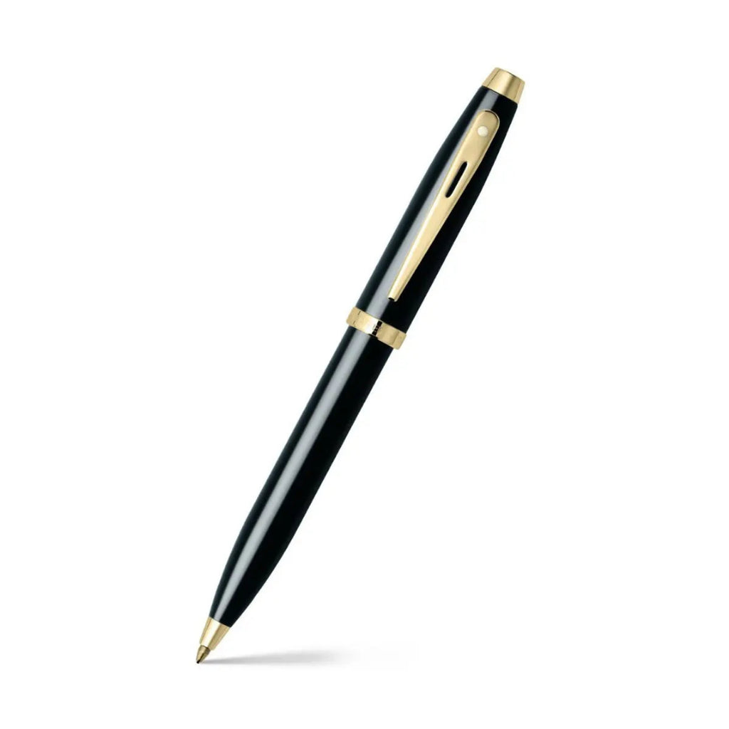 Sheaffer 100 Glossy Black Ballpoint Pen With Gold Trims angled writing shot