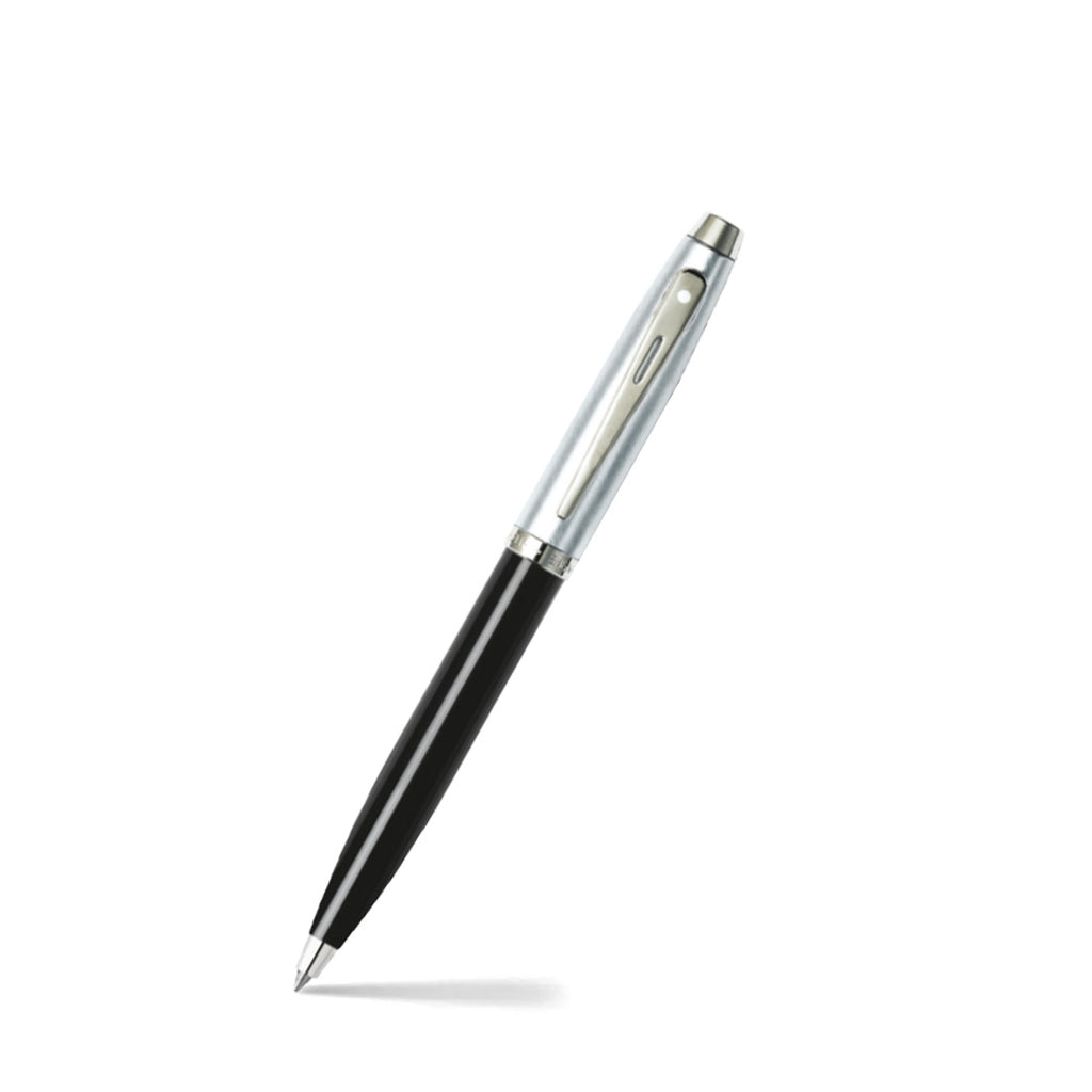 Sheaffer 100 Glossy Black Barrel Ballpoint Pen With Brushed Chrome Cap angled writing shot