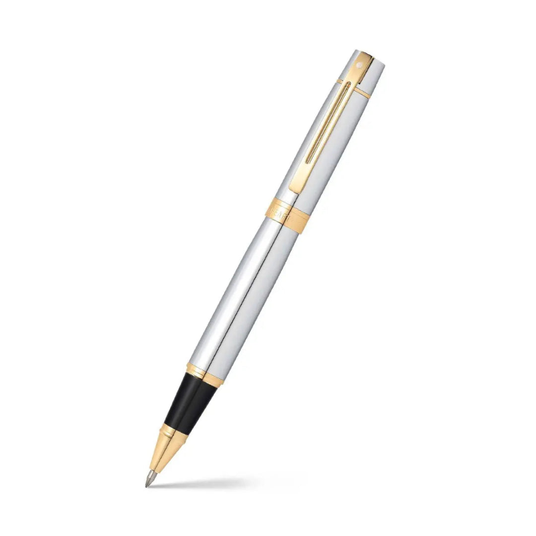 Sheaffer 300 Bright Chrome Rollerball Pen With Gold Trims angled writing shot