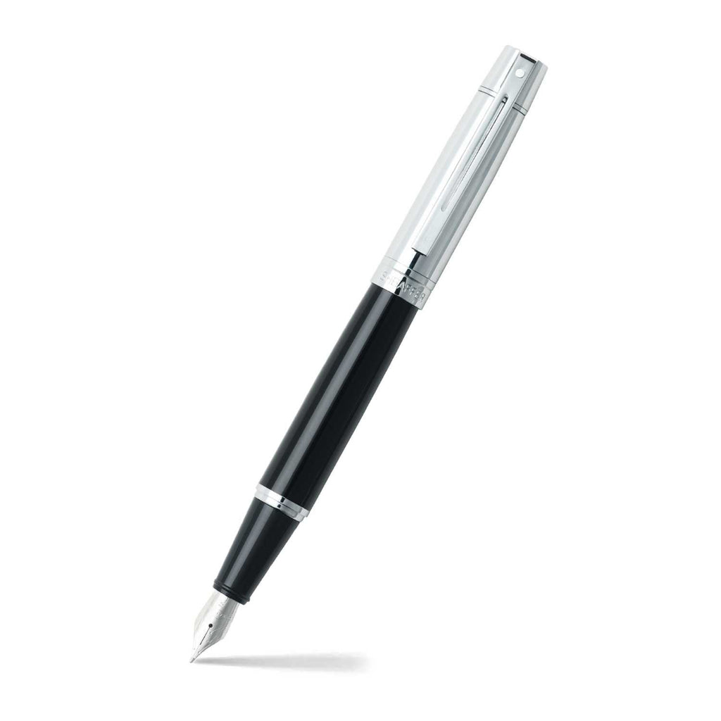 Sheaffer 300 Glossy Black and Chrome Fountain Pen With Chrome Trims angled writing shot