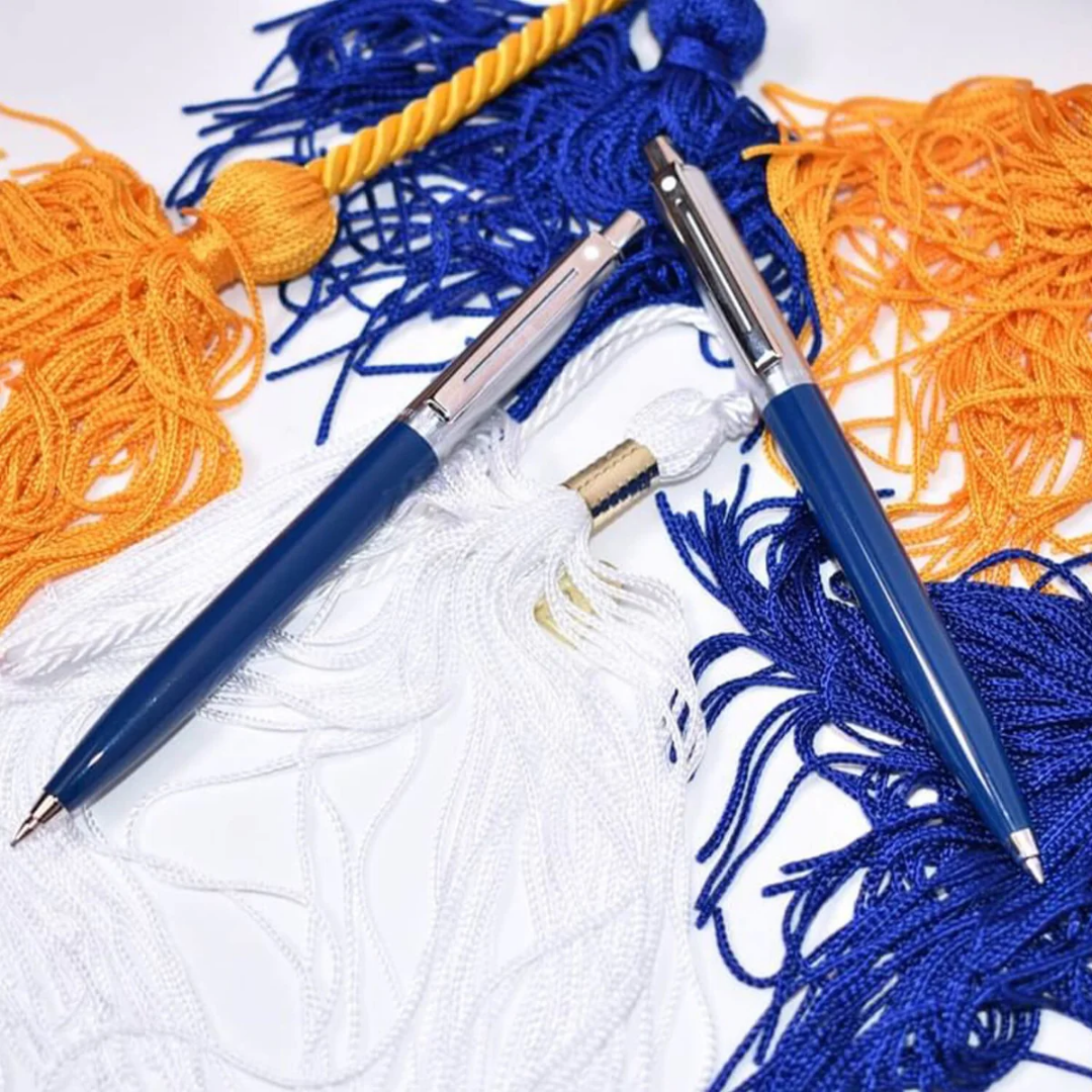 Sheaffer Sentinel Blue and Chrome Ballpoint Pen With Chrome Trims with tassel background
